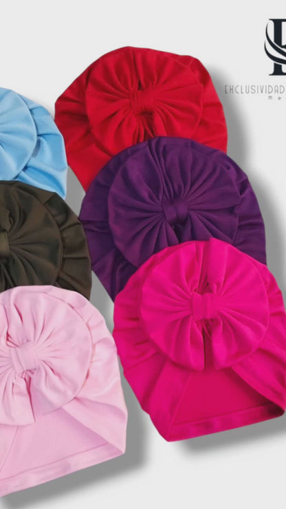 Cajita de 6 gorritas y 14 banditas elásticas.